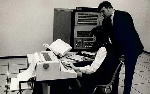 Teacher and a typing student