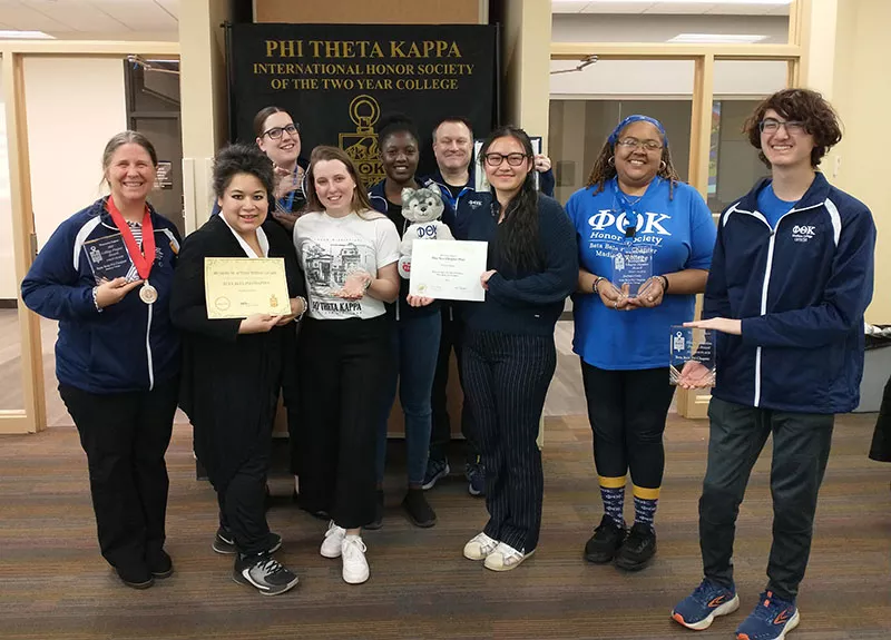 Madison College Phi Theta Kappa members display their awards