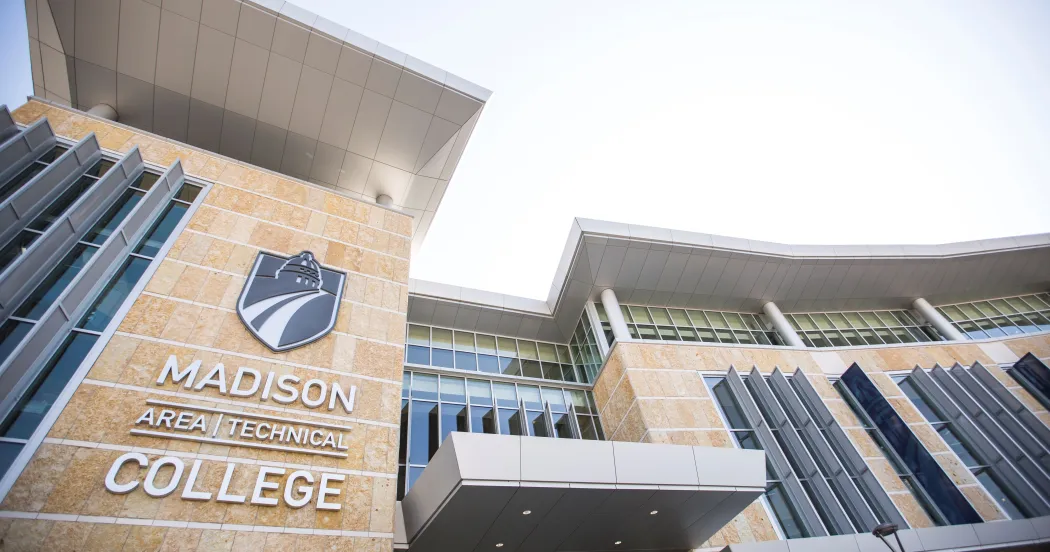 Exterior of Madison College Truax Campus with logo and 