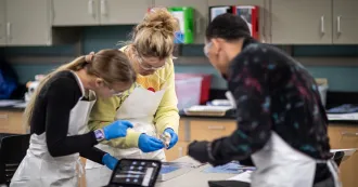 High school students working in a science lab