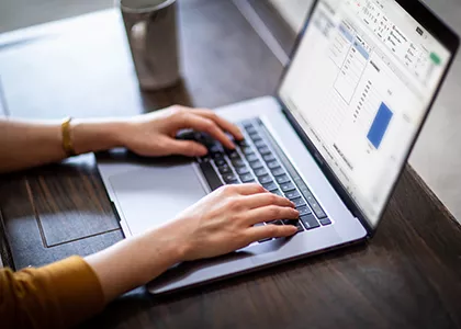 hands on a laptop keyboard