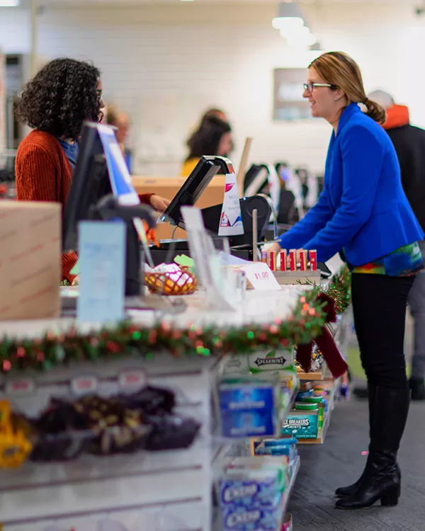 people talking at the bookstore counter
