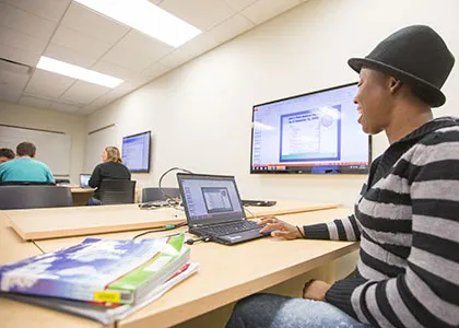 student gaining hand-on experience reviewing a business balance sheet scenario