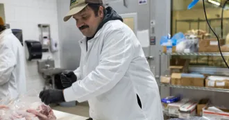 Artisanal Modern Meat Butchery student cutting up meat in class.