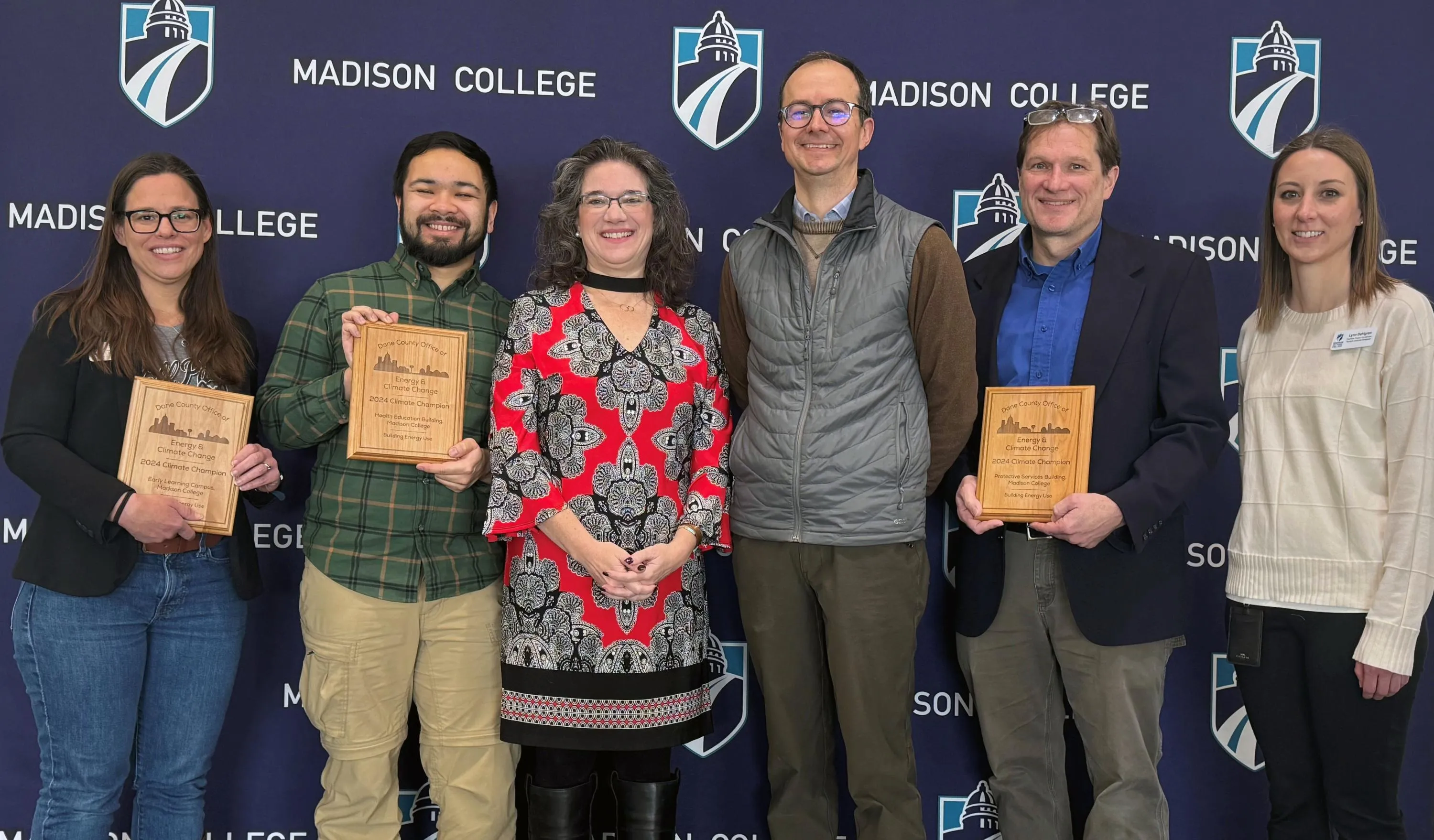 Madison College staff and faculty accept Climate Champion awards.