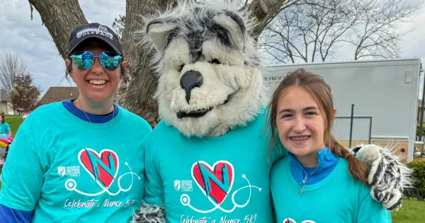 Participants of Celebrate a Nurse celebrate with Wolfie.