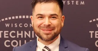 Photo of Jose Villarreal with tie and blue blazer.