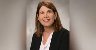 Photo of Dr. Jennifer Berne wearing a black blazer and white shirt.