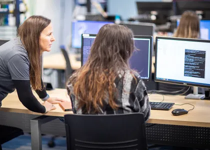 people reviewing principles and practices of cyber compliance