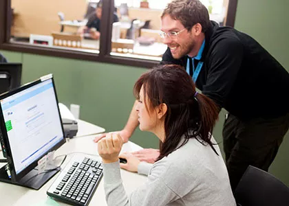 students using a computer to working on a project