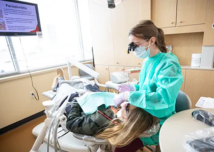 dental student working on a patient