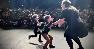 Emily Dolan’s sons run onstage during her Madison College pinning ceremony