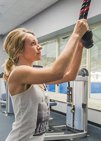 woman working out in the fitness center