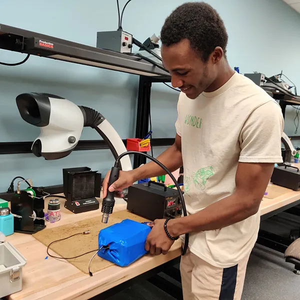 Grace Onesime Zongo, engineering pre-major grad working in lab