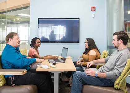 Business students collaborating on a project