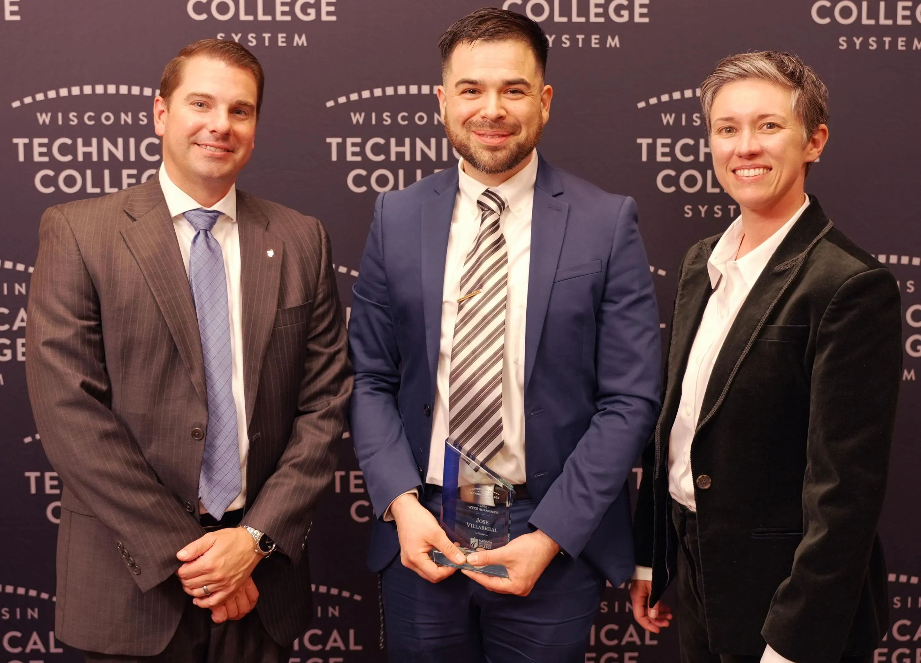 Photo of Jose Villarreal holding an award.