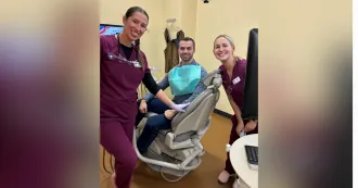 Madison College dental program students with patient.