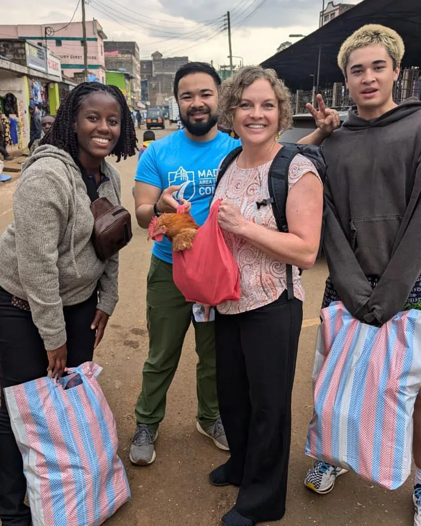 Madison College students and staff at a market in Kenya.