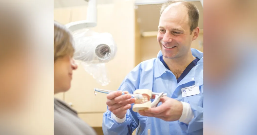 Madison College dental student with patients.