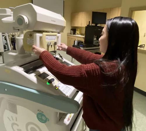 Madison College student learning how to use an medical imaging machine