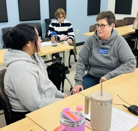 Wisconsin Technical College Systems President Morna Foy talks with a student.