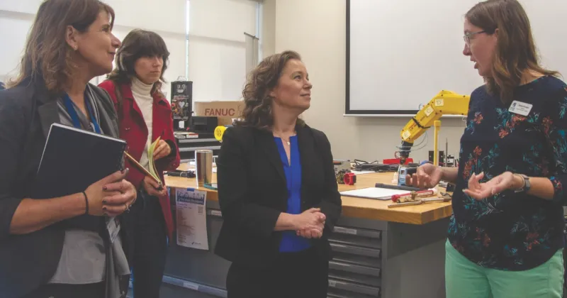 Lt. Governor Sarah Rodriquez speaks with a faculty member as President Jennifer Berne looks on.