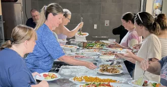 community members enjoying food at a noncredit cooking class