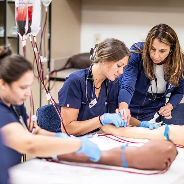 nursing students practicing IV therapy and phlebotomy