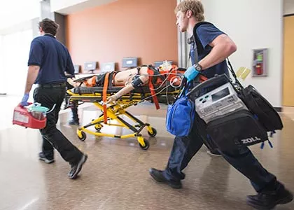 Students transporting patient