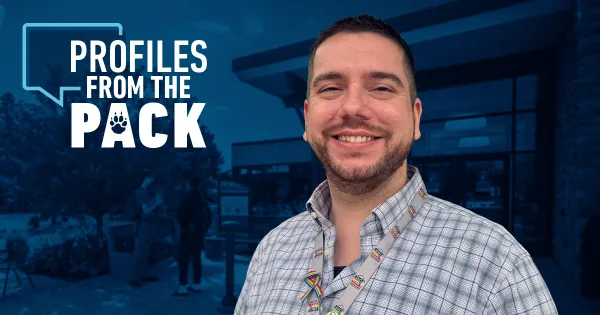 Alex Drebenstedt wearing a plaid shirt, in the background is the Fort Atkinson campus entrance.