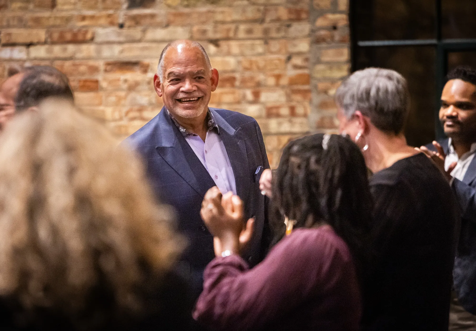 President Jack Daniels being greeted by well wishers at his retirement party.