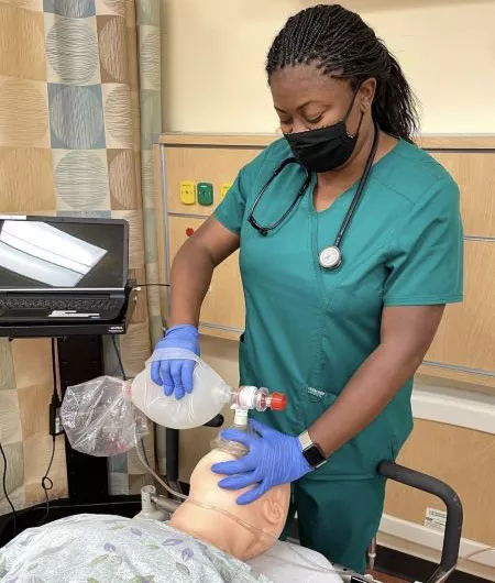 Madison College student learning about respiratory techniques