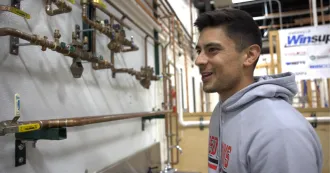 Madison College student Riley Bailey in a classroom.