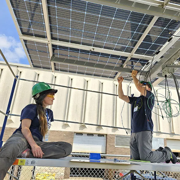 STEM students in lab working on solar panels