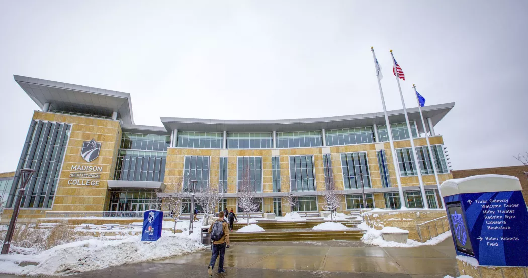 Flags outside main Truax Campus building.