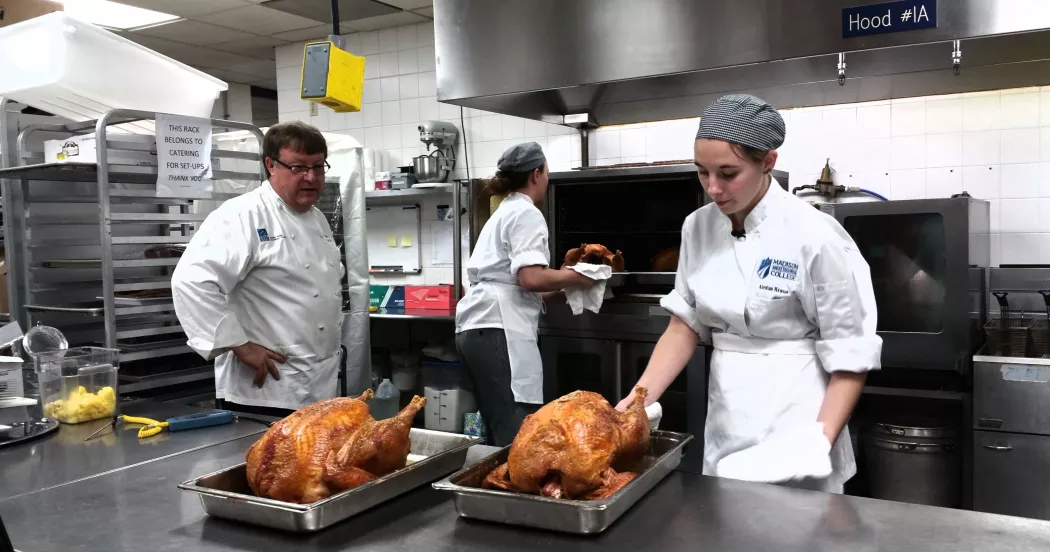 Culinary Arts students cooking turkeys for the River Food Pantry.