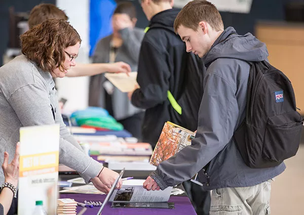 student and admission counselor at transfer fair