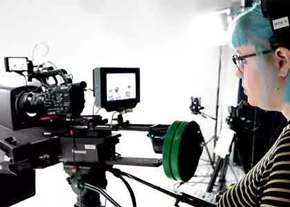 student looking through camera