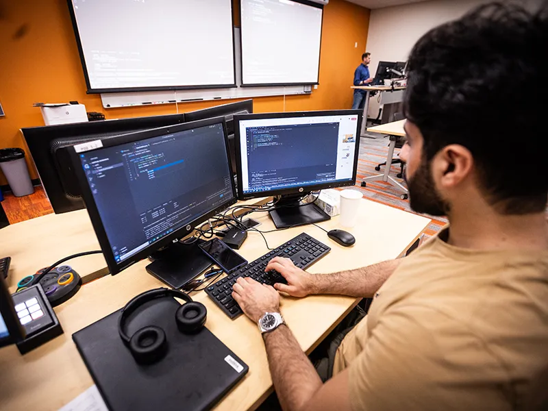 Madison College web developer student coding in lab